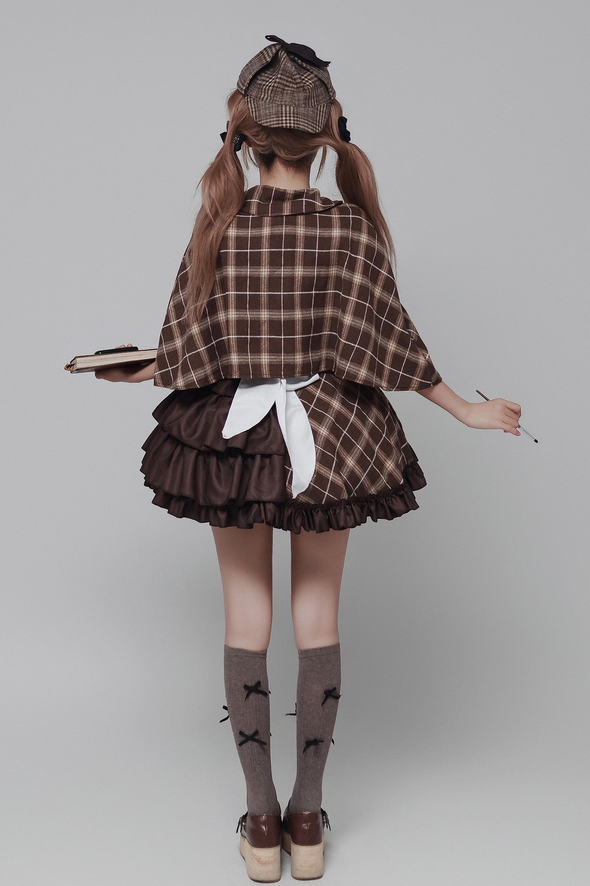 rear shot brown grid maid outfit layered ruffle skirt white back bow plaid cape detective cosplay