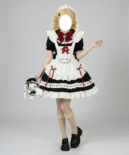 female model wearing bell bow maid dress holding plush bunny bag
